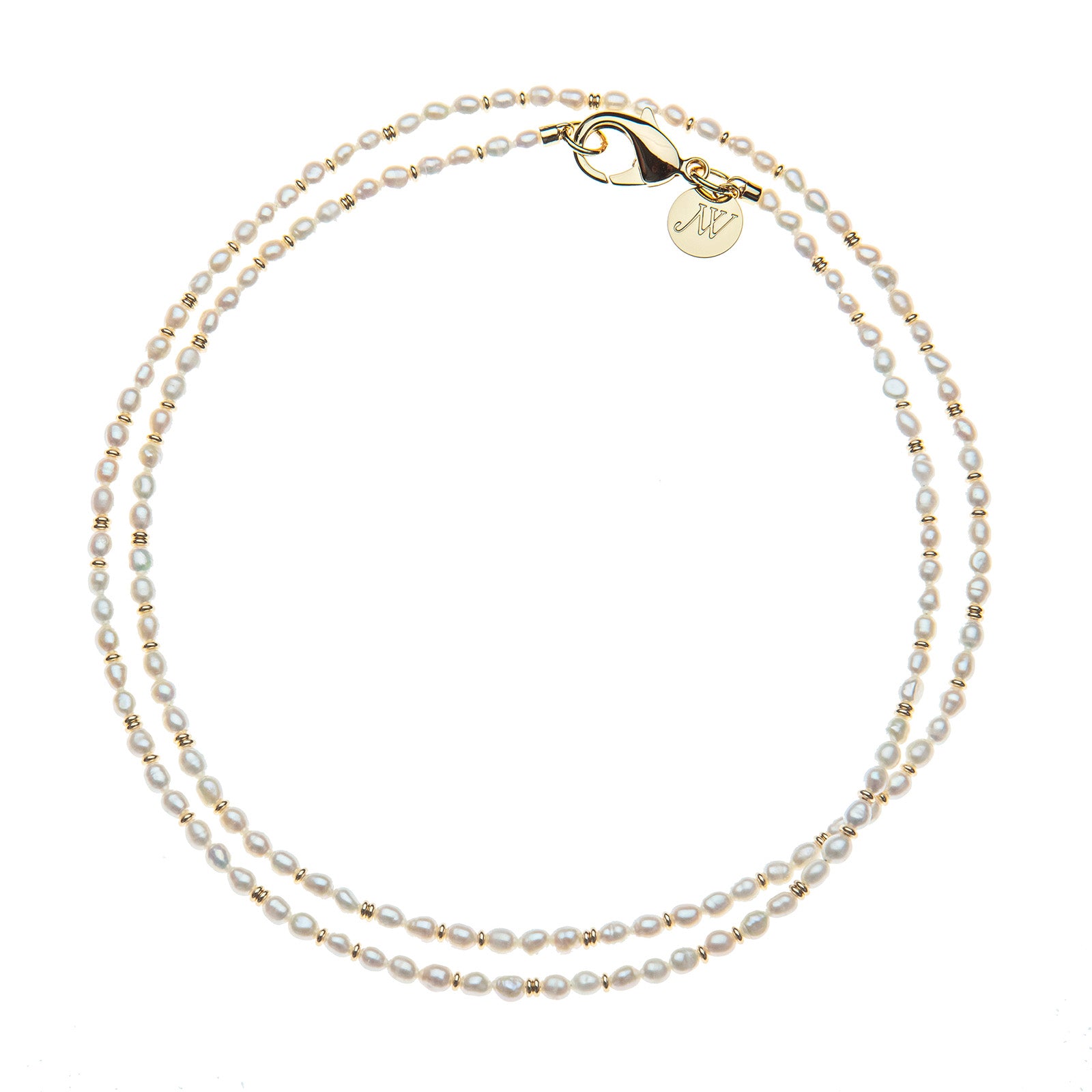 Double wrap beaded necklaces with white rice pearls and interspersed small gold beads. Features oversized gold lobster clasp