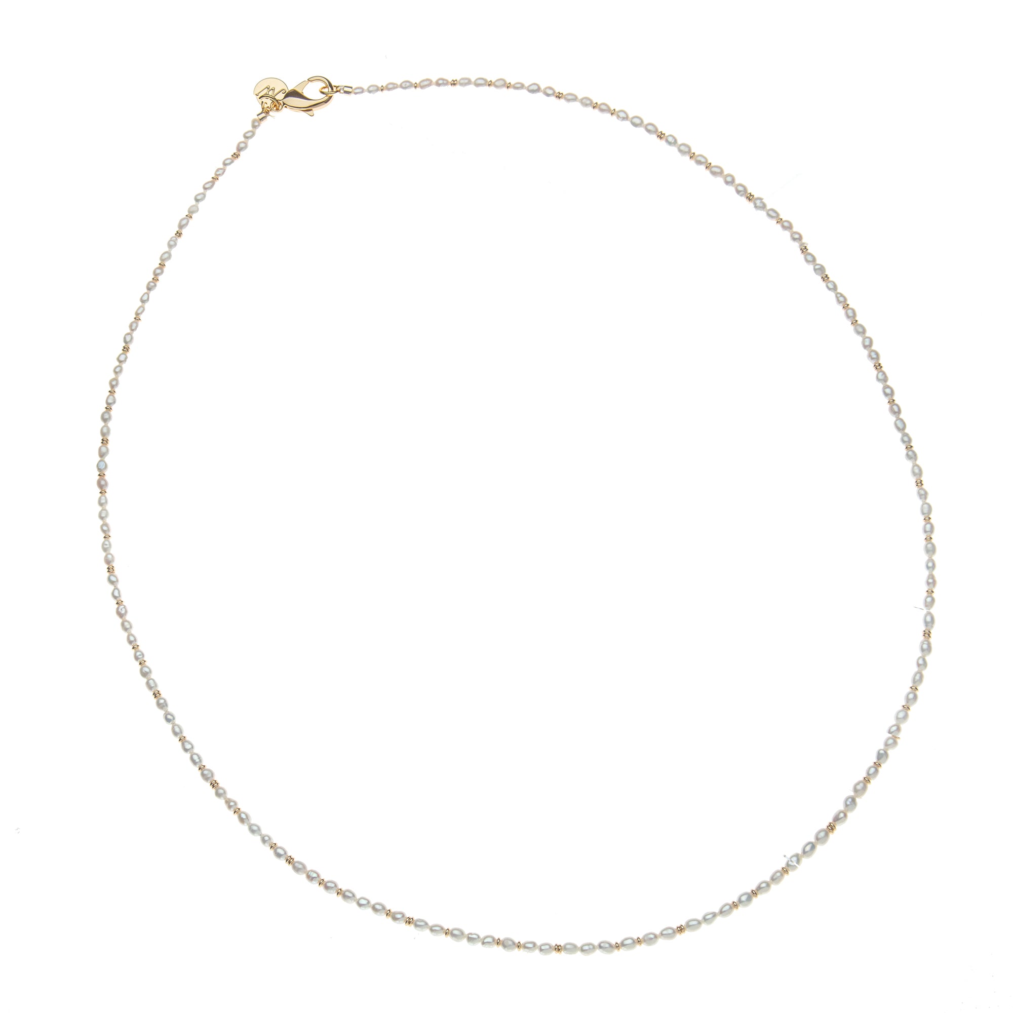 Beaded necklaces with white rice pearls and interspersed small gold beads. Features oversized gold lobster clasp