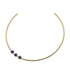 Gold neck cuff with three lapis cabochons sitting off center