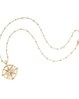 Gold guiding star pendant on satellite chain