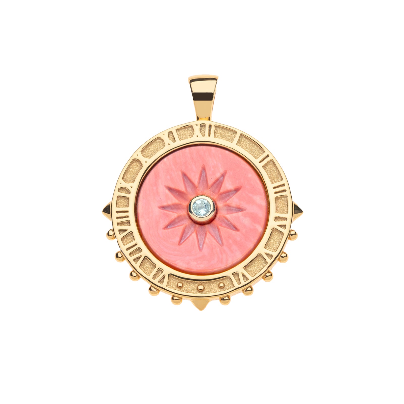 Carved coral sundial pendant with sky blue topaz center stone. Pendant features gold edge that features roman numerals