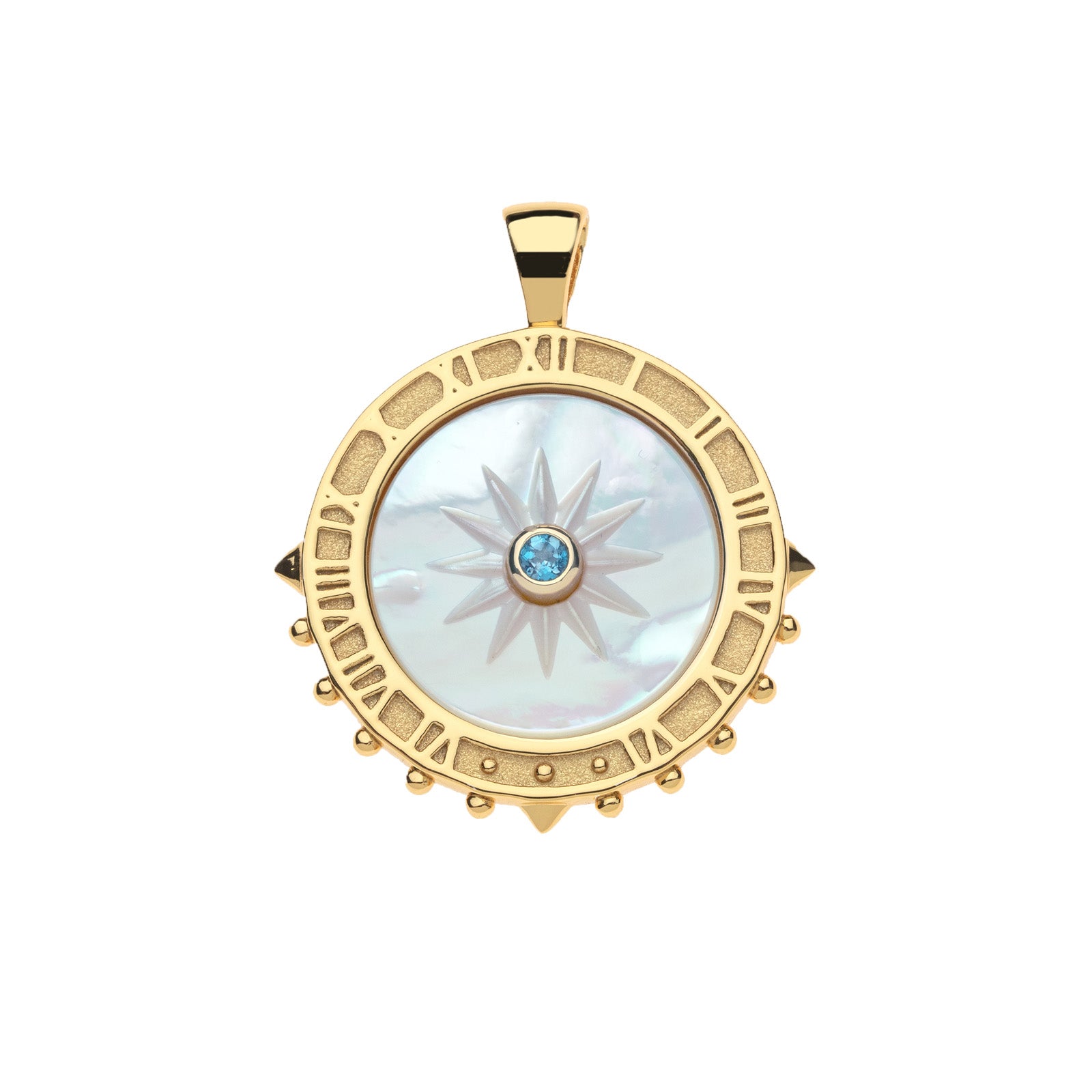 Carved mother of pearl sundial pendant with London blue topaz center stone. Pendant features gold edge that features roman numerals