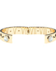 View of hinged cuff open to show roman numerals and star details inside 