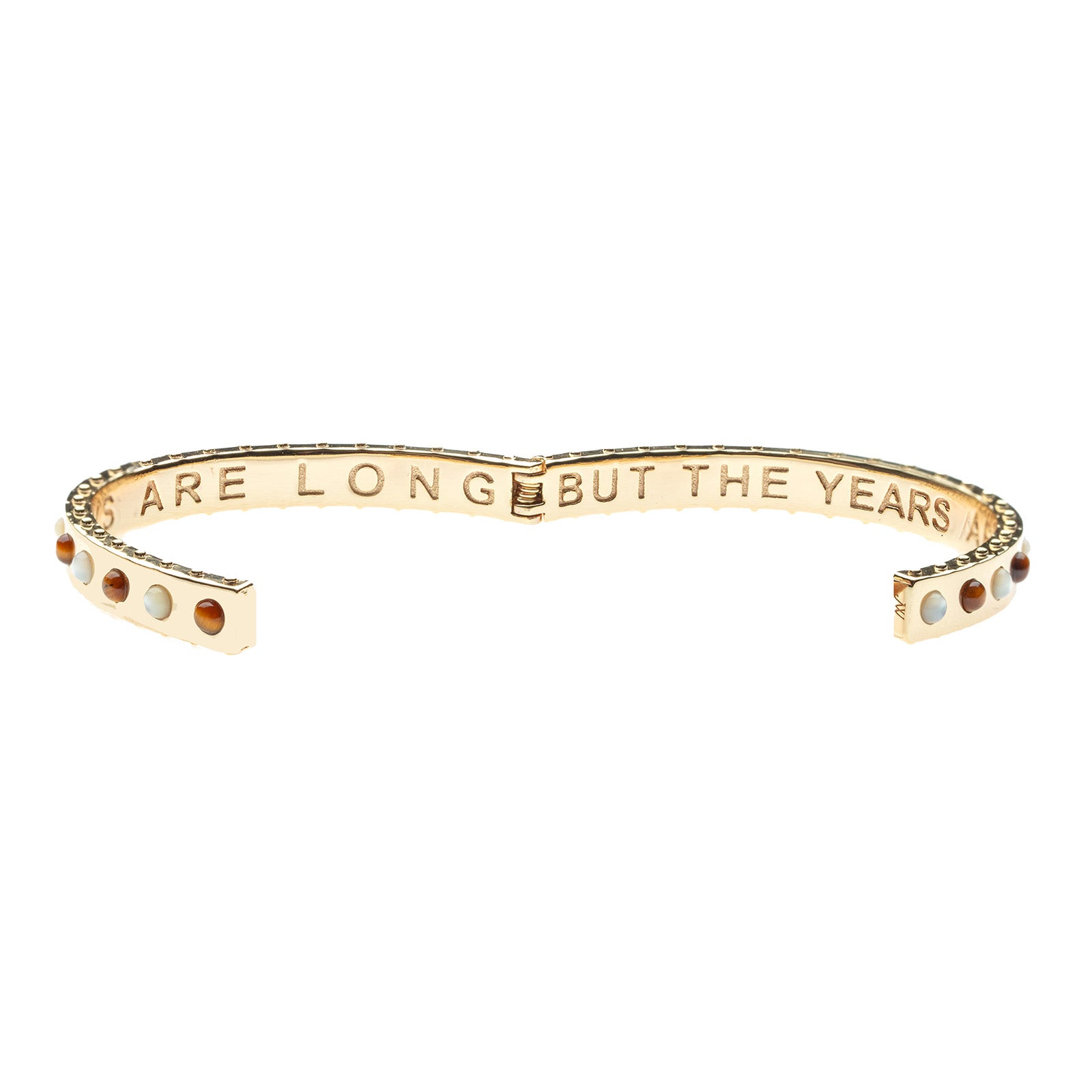 Hinged cuff shown open to show the inscribed phrase "the days are long but the years are short"