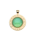 Gold coin pendant features roman numerals and moon phases inscribed on the edge and a green glass dome in the center with sundial motif underneath