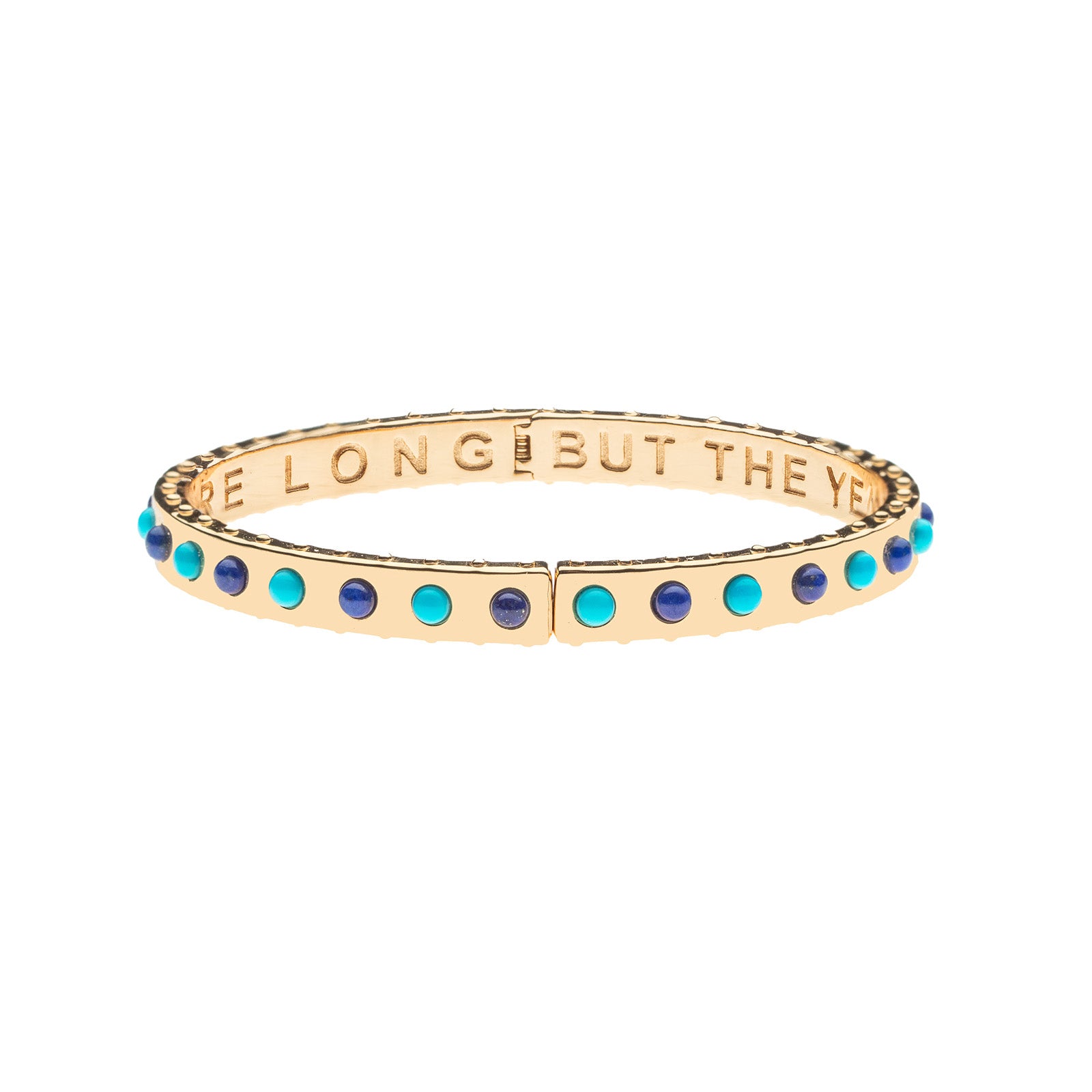 Gold hinge cuff features alternating lapis and turquoise cabochons and the phrase THE DAYS ARE LONG BUT THE YEARS ARE SHORT inscribed inside 