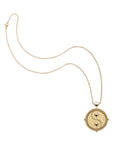 Gold small Gemini coin pendant on classic rolo chain
