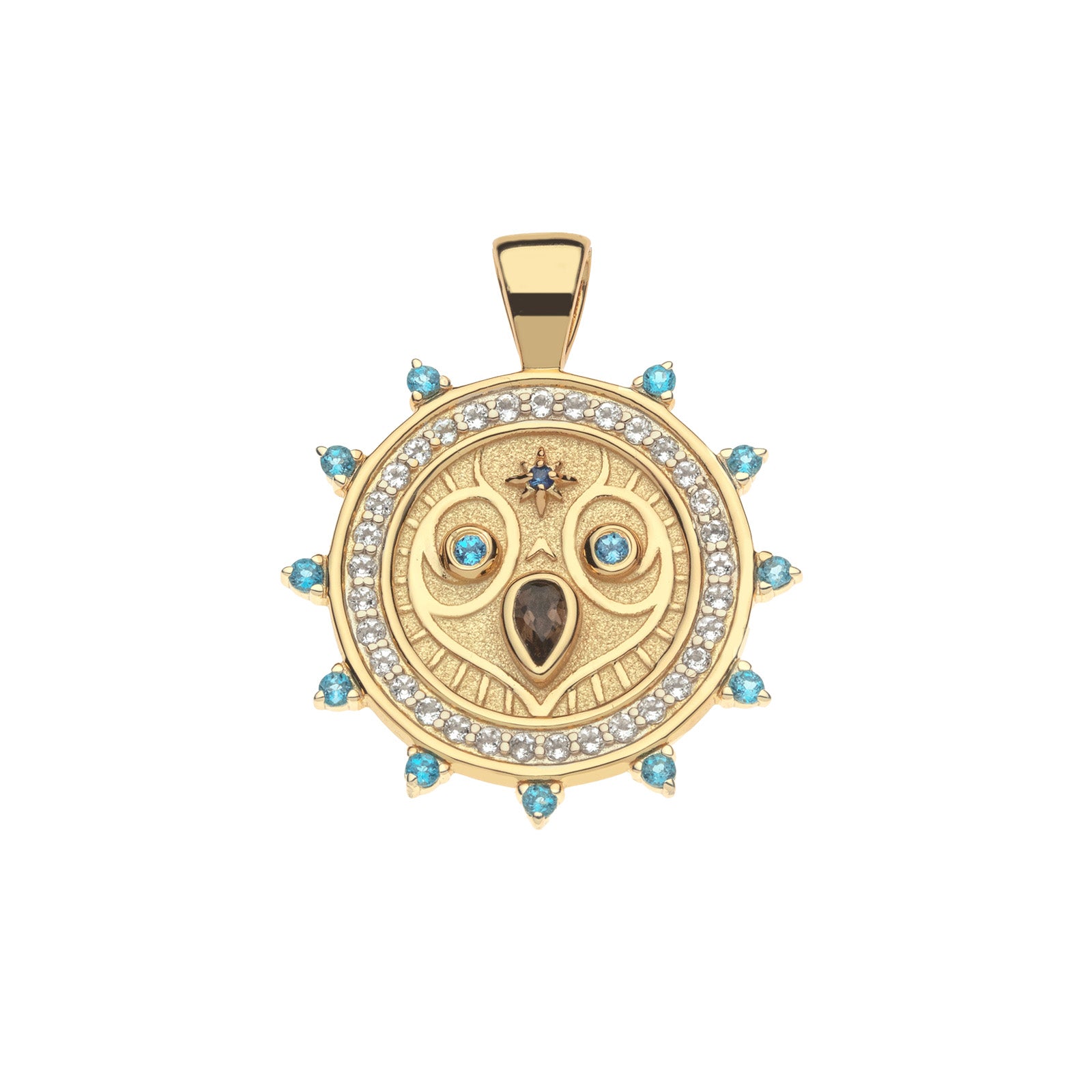 Gold coin pendant featuring and owl face with embellished stone details of London Blue Topaz, White Topaz, Blue Sapphire, and Smoky Topaz