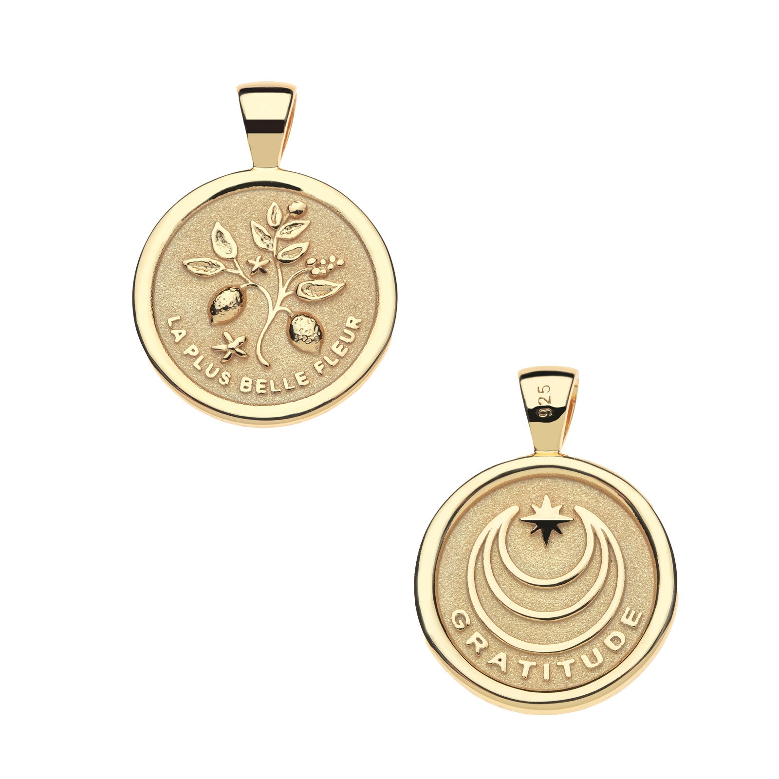 Front of gold coin pendant features a branch with lemons and lemon blossoms and the phrase "LA PLUS BELLE FLEUR" and back of pendant features moon and star logo with the word "GRATITUDE"
