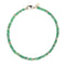 Green jade beaded necklace features interspersed gold and silver flat beads as well as oversized gold lobster clasp
