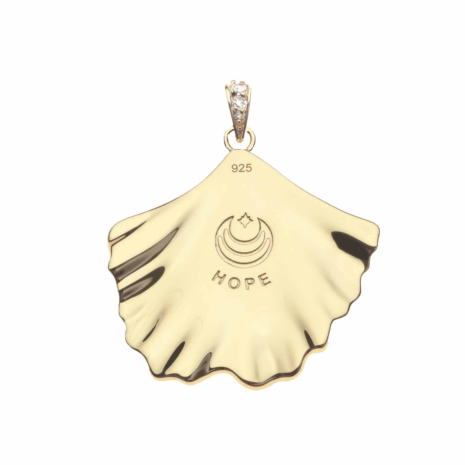 Back of gold ginkgo leaf pendant features moon and star logo and the word HOPE