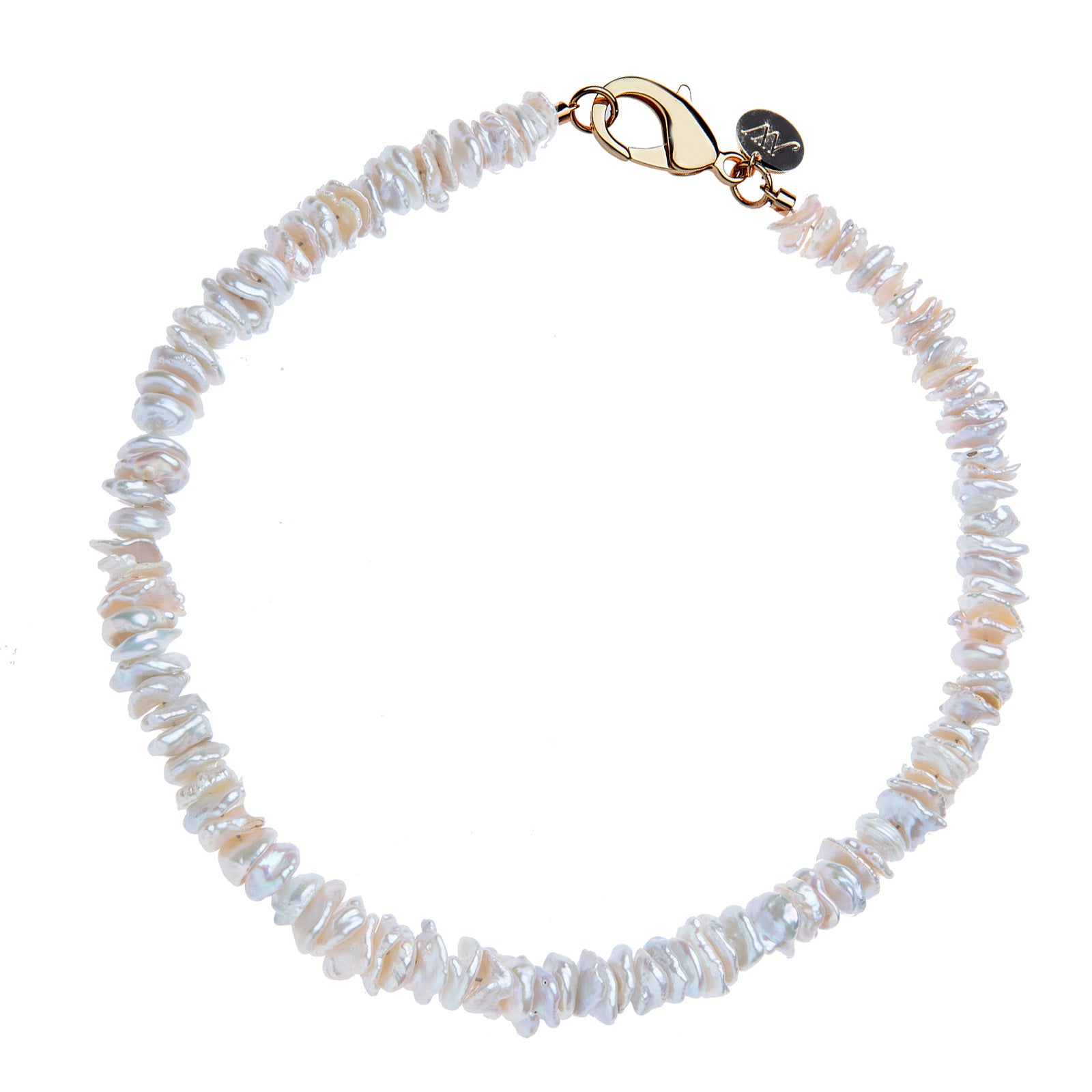 Beaded necklace of mother of pearl discs with oversized gold lobster clasp