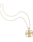 Gold dogwood cutout coin on classic rolo chain