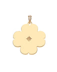 Back of gold engravable dogwood flower pendant features a star detail in the center