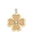 Gold dogwood flower pendant with white mother of pearl center and white topaz details on the bail