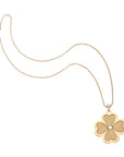 Gold dogwood flower pendant on classic rolo chain