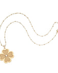 Gold dogwood flower pendant on satellite chain