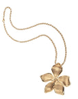 Gold periwinkle flower pendant on grande rolo chain