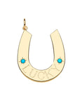 Gold horseshoe pendant features the word LUCKY and two turquoise cabochon stones
