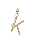 Gold letter K pendant with flower detail and white topaz accents on the bail