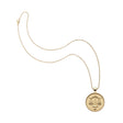 Gold small Libra pendant on classic rolo chain