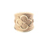 Gold cigar band ring with quatrefoil design featuring arrows and a heart
