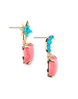 Side view of the love you to the moon and stars drop earrings in coral