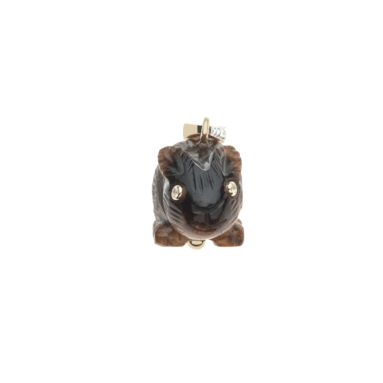 Carved rabbits face featuring white topaz eyes set in gold