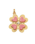 Gold four leaf clover pendant features Dyed Bamboo Coral hearts on each leaf and white topaz stone in the center
