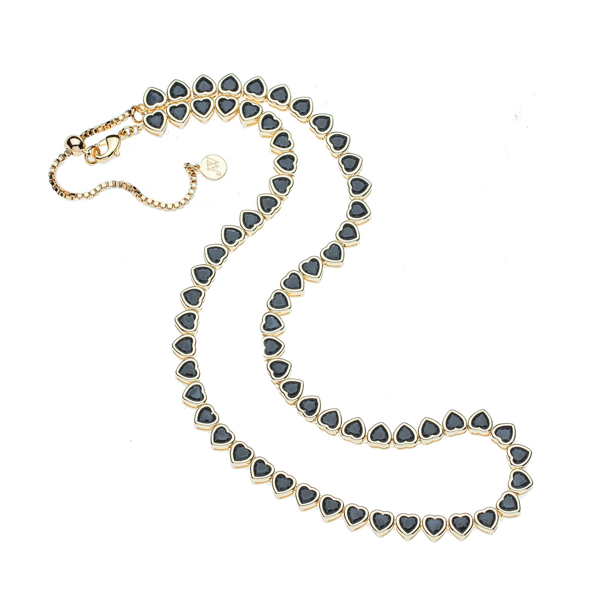 Gold tennis necklace features heart shaped black CZ stones