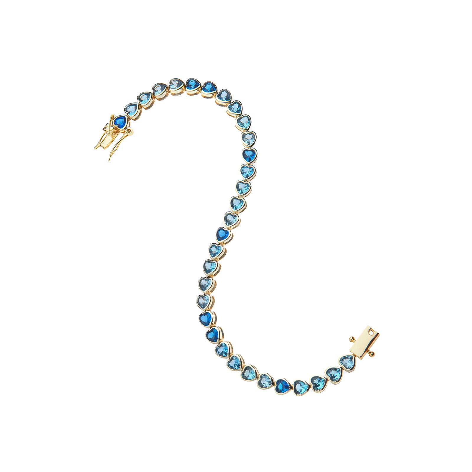 Gold tennis bracelet features heart shaped CZ stones in varying shades of blue