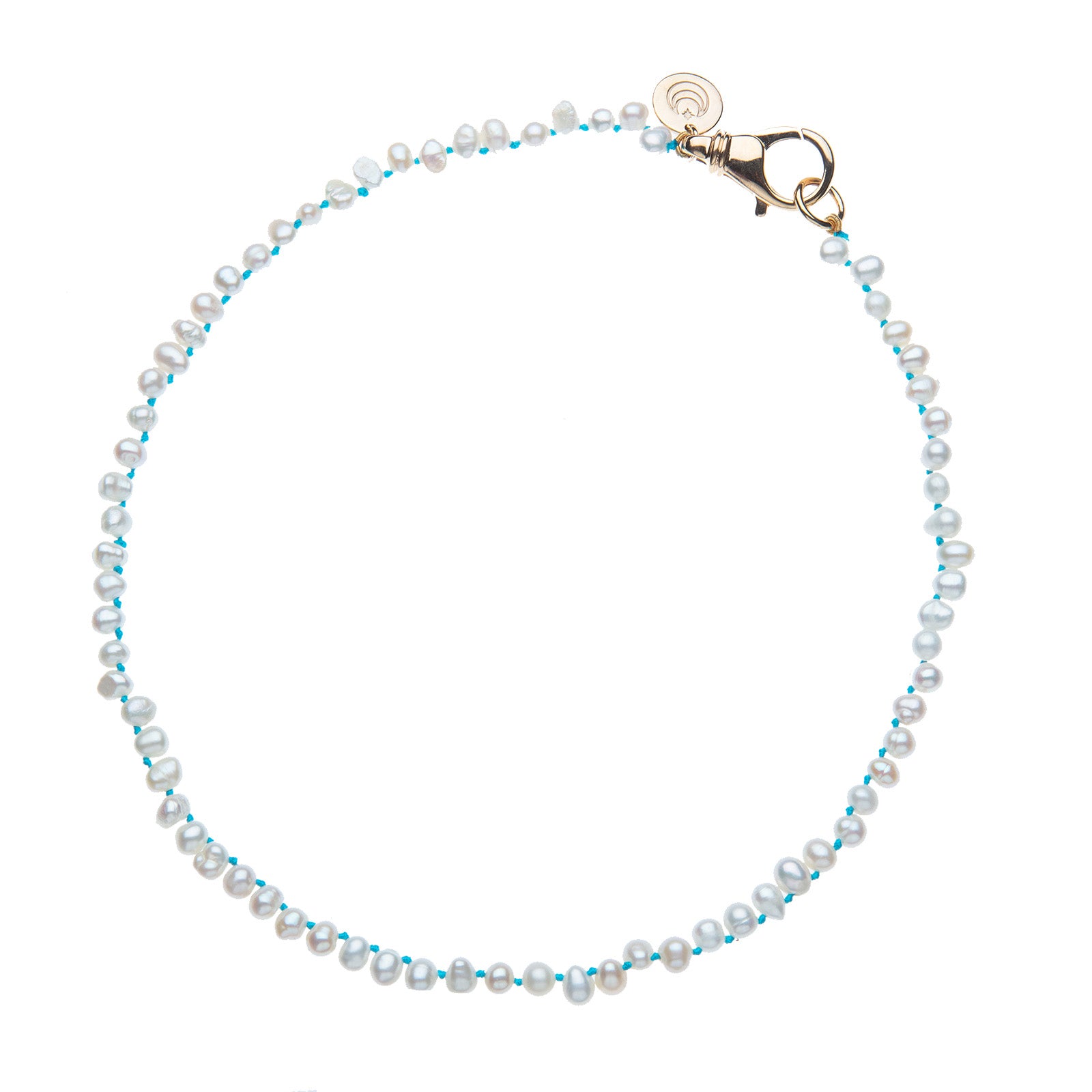 Pearl necklace on knotted turquoise cord with gold clasp