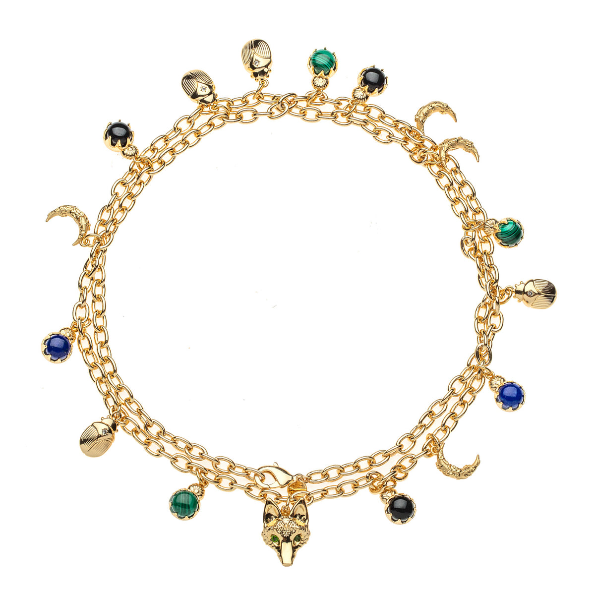 Gold double wrapped chain featuring crescent moon, fox, scarab, malachite, onyx, and lapis charms