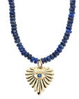 Close up of the gold evil eye full heart pendant