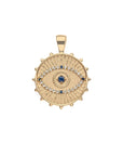 Gold coin pendant featuring evil eye design with white topaz and blue sapphire stones