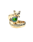 Gold ring of a fox curled around a green diopside stone