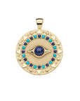 Gold coin pendant features evil eye motif with lapis stone at the center and border of lapis and turquoise cabochons