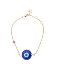 Dainty 10k gold chain bracelet featuring blue glass evil eye and pink tourmaline accent
