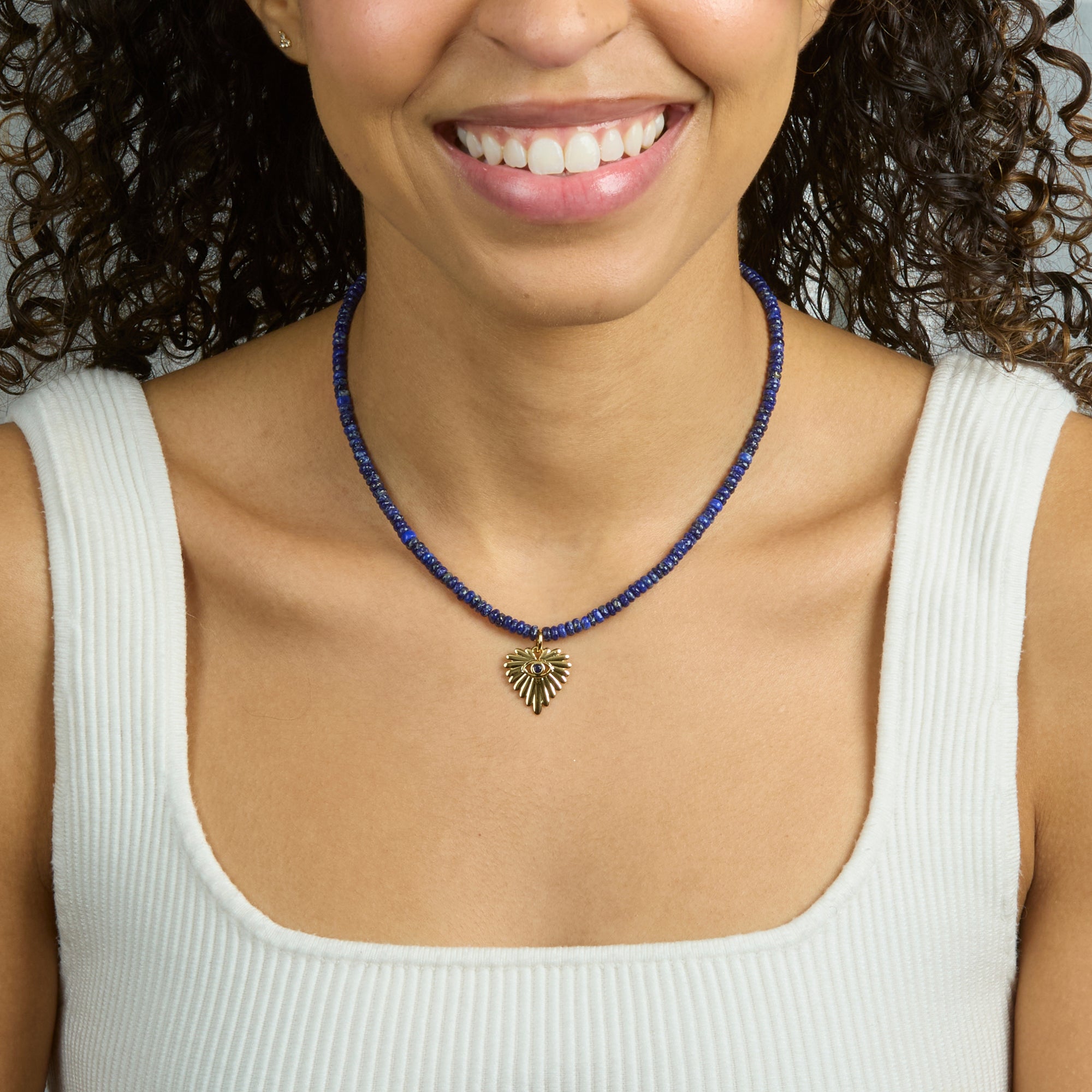 Model wearing the protect eye on your heart beaded necklace
