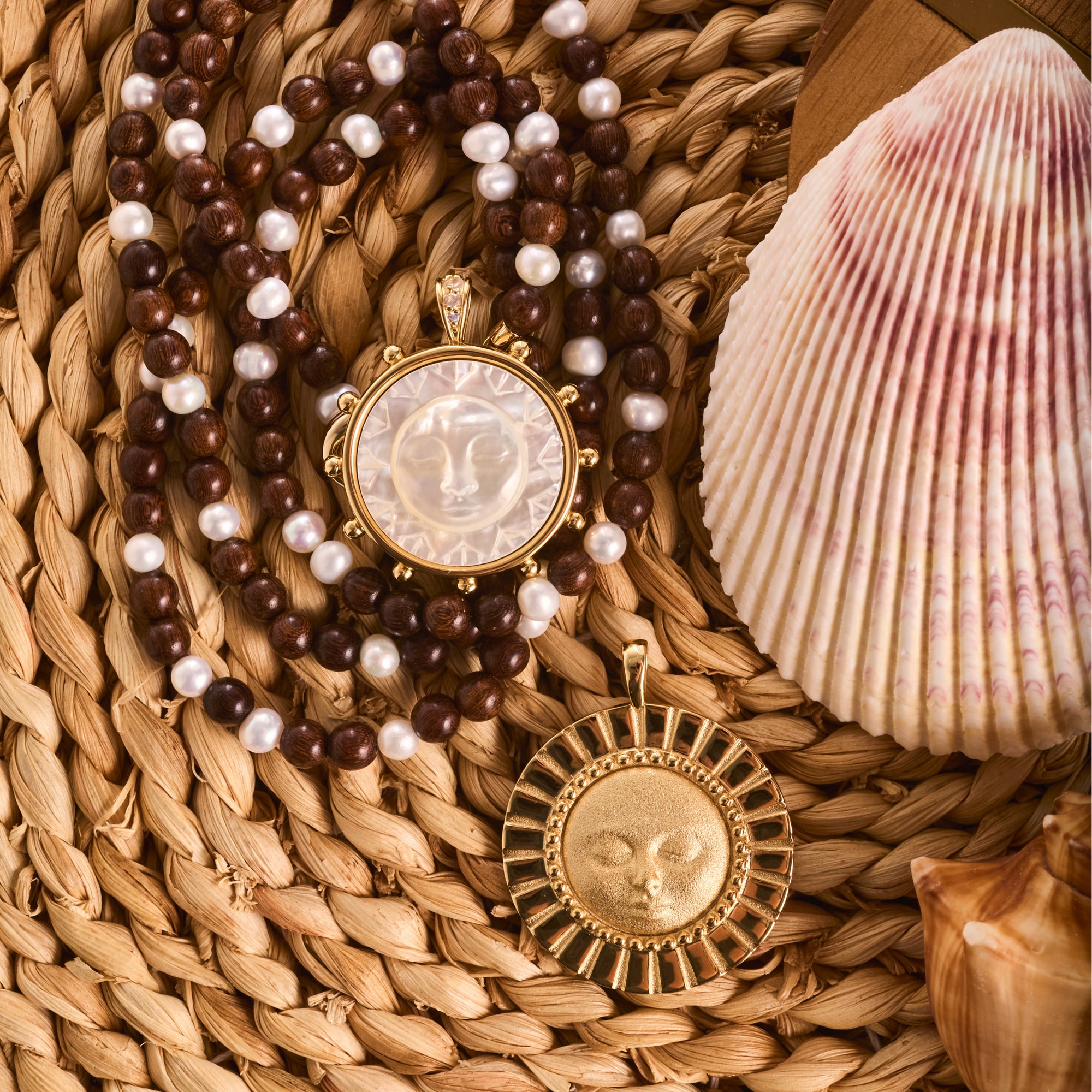 Stylized shot of strong enduring sun, strong ever shining sun, and wood and pearl double wrap in a basket with a seashell