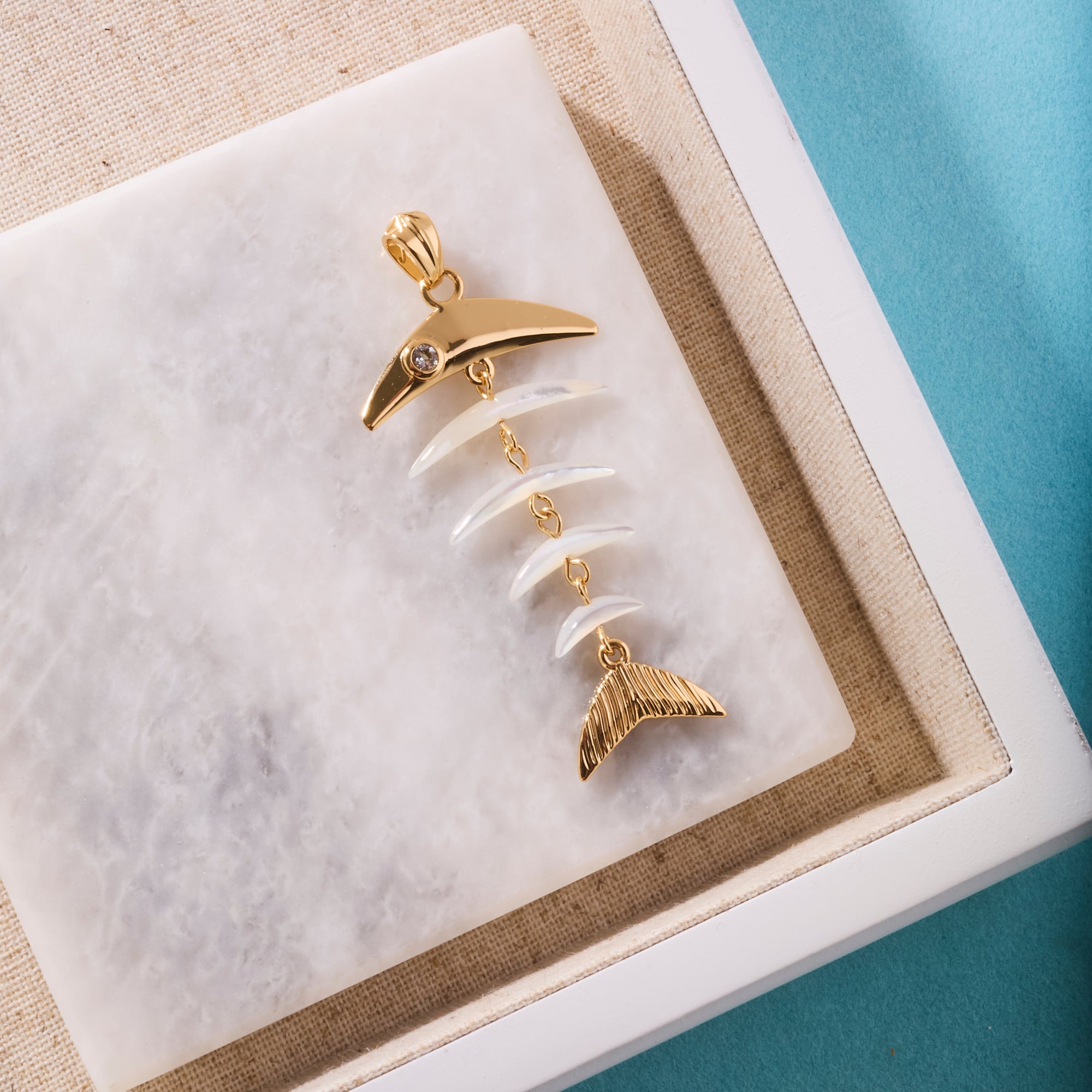 Stylized shot of the strong fishbone pendant