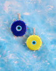 Protect traveling eye pendants in blue and yellow