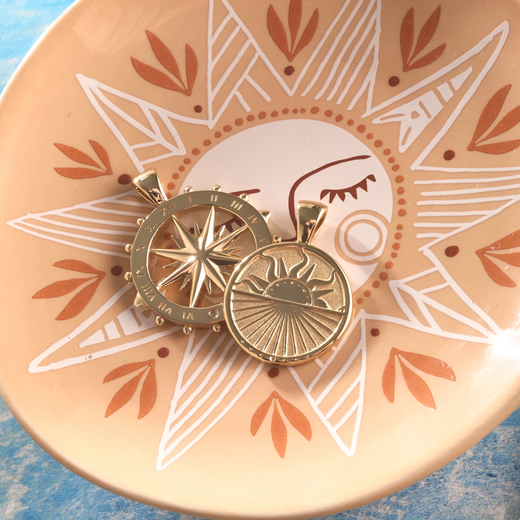 Stylized shot of the strong over the horizon coin and forever sundial cutout in dish featuring sun motif