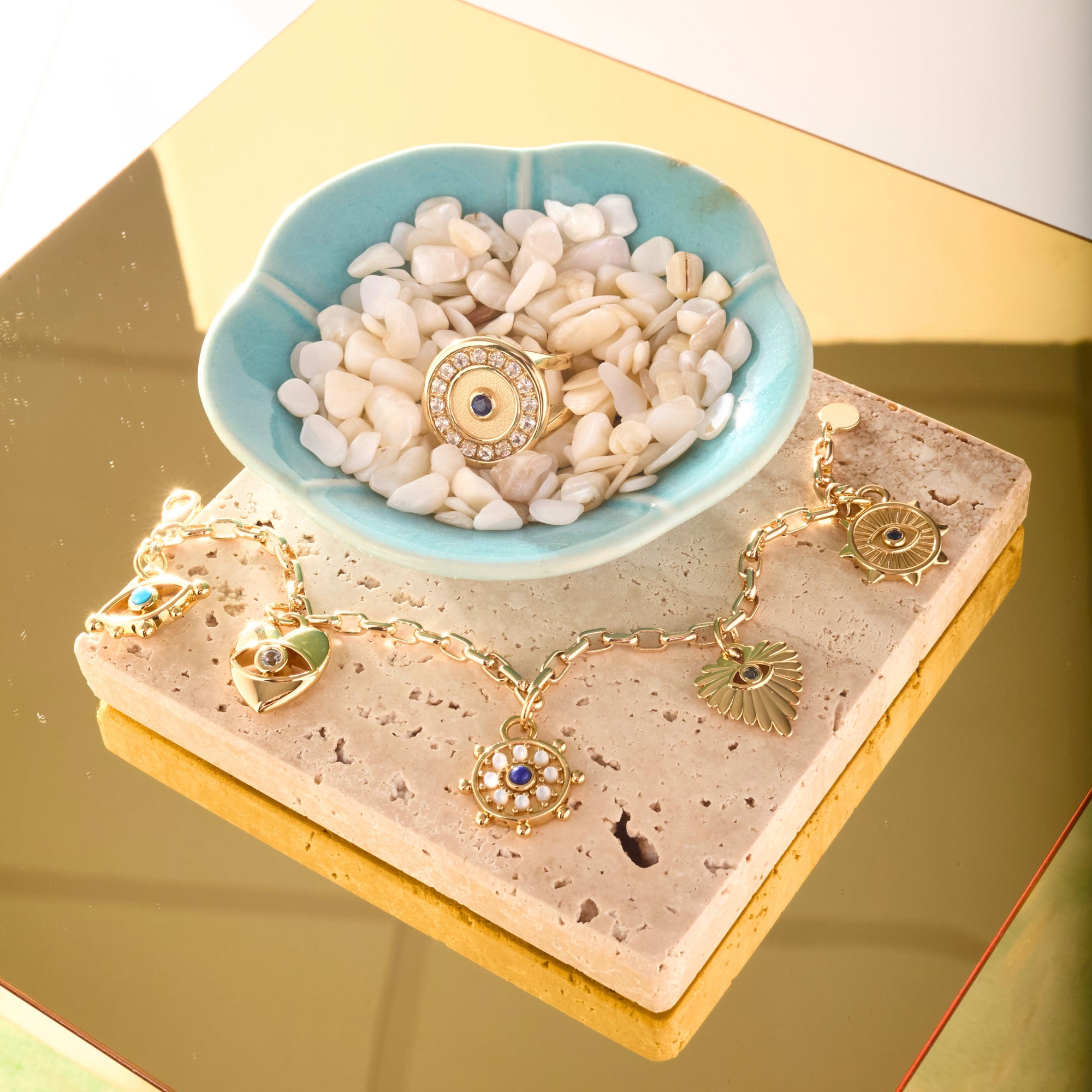 Stylized shot features protect evil eye bracelet and protect eye on you ring