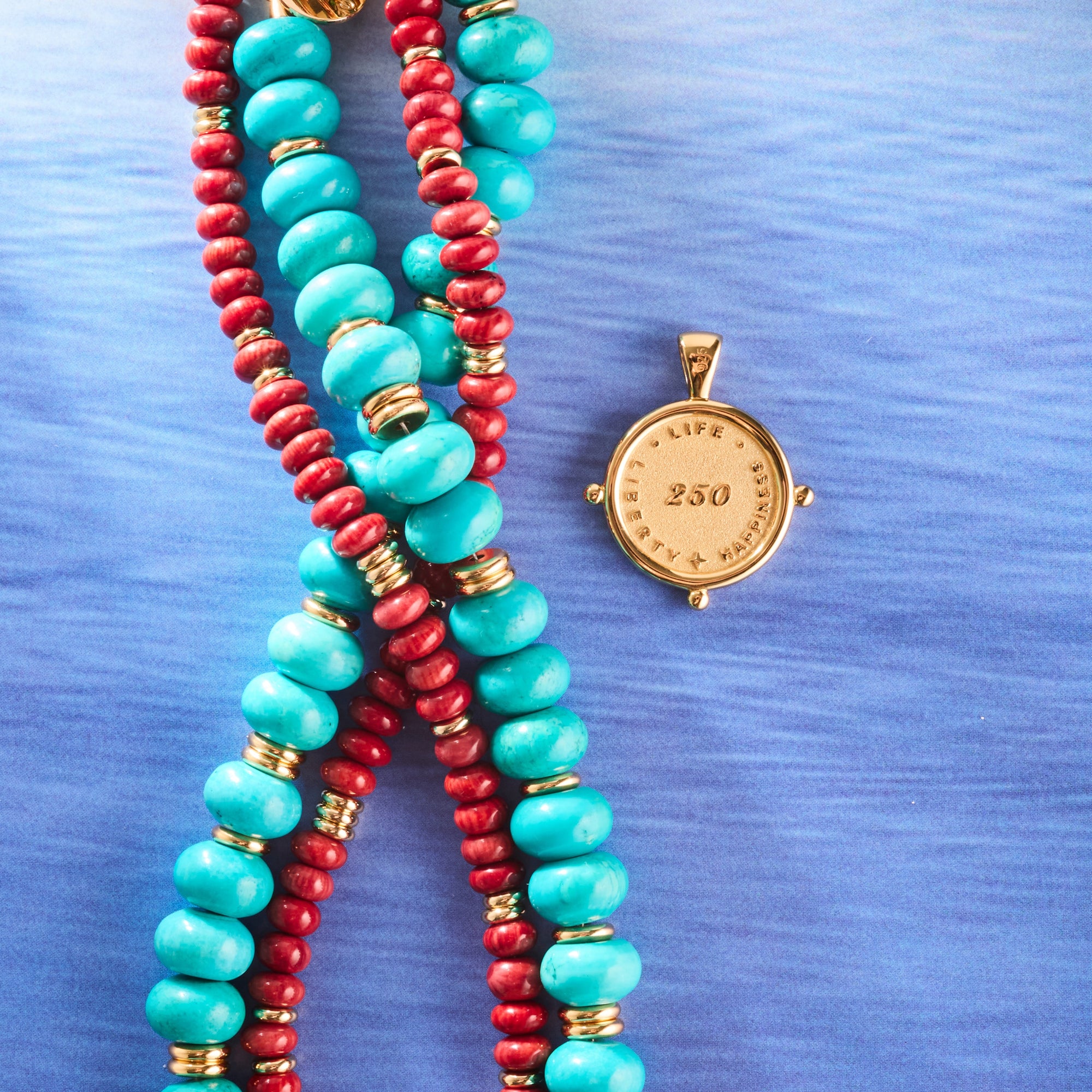Stylized shot of the red coral gumdrop, strong stone collector in turquoise, and protect eagle petite embellished coin