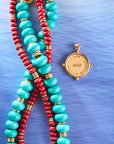 Stylized shot of the red coral gumdrop, strong stone collector in turquoise, and protect eagle petite embellished coin