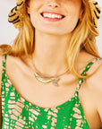 Model wearing the keep swimming fish on the neck cuff