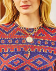 Model wearing the protect ancient eye tusk, as well as the protect original coin on the chunky chain.