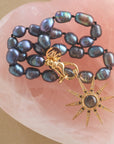 Stylized shot of the black pearl knotted with the sparkling supernova in black mother of pearl
