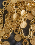 Stylized shot of the love amore coin necklace